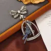 Niş Rhinestone Parrot ağır hizmet tipi yay, broş, ceket, oyuk kuş kafesi ve broş aksesuarları