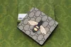 M60223 Mężczyźni projektanci zwierząt portfel Moda Krótki portfel skórzany czarny wąż tygrys pszczoła luksusowa torebka uchwyty karty z pudełkiem prezentowym