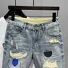 Mäns shorts Ny ankomst 2023 Summer Mens Casual Denim Shorts Fashion Cat Whispers denim Torn nödställda patch tight jeans J240228