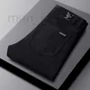 Męski projektant dżinsów Pure Black High-end Mens dżinsy jesień i zima nowe lekkie luksusowe małe proste rurkę Slim Fit Casual Elastyczne spodnie Trend O9xv
