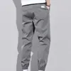 Męskie spodnie Mężczyźni Ogólnie proste stały kolor ładunkowy wiosenny letni sznurka kostka związana z spodniami do pracy