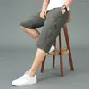 Pantaloncini da uomo Estate Spiaggia Abbigliamento casual Tinta unita Vitalità giovanile Tasche stile safari Pantaloni al ginocchio elastici a vita media quotidiana