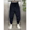 Pantaloni da uomo Abbigliamento uomo Inverno Nuovo caldo piumino di cotone ispessito Tuta da uomo Tasche Pantaloni di cotone Piedi raggruppati Pantaloni Harem Pantalones HombreL2402