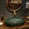 Torneiras de pia do banheiro Torneiras de cerâmica Lavagem de mesa estilo europeu El Homestay Art Face Washing
