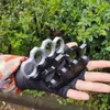 Outdoor Unisex Survival Gear Brass Knuckles Multifunctionele vier vingerring Punching Belt Buckle Keychain
