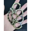 Snabbt leverans Limited Editon Gaming Knuckle Hard Four Finger Rings Iron Fist Factory Survival Tool Window Erents Ring Keychain Wholesale Accessory Design 782461