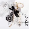 Keychains Bow-Knot Imitation Pearl Perfume Crystal Bottle Iron Tower Chain Keychain Car Key Ring Bag Charm Accessories Girl Keyring Gift RMU5