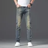 Spain designer men's jeans Retro blue distressed jeans straight jeans slimming stretch denim pants back pocket Classic logo steel stamp man Hommes casual trousers