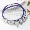 Bracciale stile di lusso viola Bracciale con corda in pelle a doppio anello Bracciale con pendente in rilievo margherita smaltata femminile Boutique Commercio all'ingrosso di gioielli fai da te