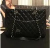 Célèbre noir Em cuir femme sac à bandoulière glands fourre-tout femmes sacs à main dame lettre messager femme sacs de soirée