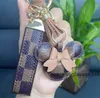 Designer Keychain Wallet Keyring Purse Pendant Car Chain Charm Bucket Bag Flower Mini Coin Holder Keychains Trinka Gifts Tillbehör KLKH