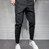 Pantaloni da uomo 2023 Pantaloni formali sottili Giacca sportiva da uomo Moda coreana Abito nero maschile Abito classico Bianco Harem A44