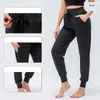 Lull Women Yoga Ninth Pants Running Fitness Joggers med dragkedja Pocket Hög midja Elastiska avslappnade joggingbyxor 4 färger D12368 Gym slitage