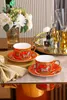 Canecas Conjuntos de xícara de café de luxo Euro Royal Court Bone China Cups Golden Handle Afternoon Tea Party Set com colher Caixa de presente Talheres 230901