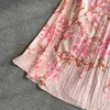 Edizione coreana primaverile e autunnale Collo alto a maniche lunghe con vita avvolta per mostrare un sottile abito a camicia a pieghe stampato a trapezio Elegante abito lungo altalena