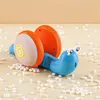 أحدث لعبة Tiktok المريحة Snail Electric Light-Up Music Kids Toy