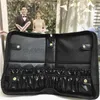 Borse da viaggio in pelle PU Borsa pieghevole per pennelli da trucco da donna Organizer Cosmetici da viaggio per donna Scatola per trucco Strumenti di bellezza Accessori per il lavaggio Borseborse alla modanegozio