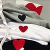 Ropa de diseñador de marca de nicho bordado de corazón rojo pequeño algodón puro con capucha con capucha con capucha para hombres y mujeres amantes amor mangas largas