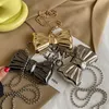 Вечерние сумки Металлический мини -лук кросс для женщин мода серебряной золотой плеч с кладкой кошельки кошельки монеты 230901