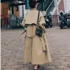 女性のトレンチコートコルタベントフェミニナ春秋の女性ロングコートストラップストームベルトルーズアウトドアファッション