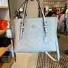 2023 Nova bolsa feminina Mollie 25 perfumada Bretto Danning Jacquard Shopping de um ombro crossbody com 55% de desconto na fábrica online