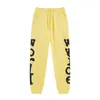 Żółte spodnie dresowe spodnie Mężczyźni bawełniane nadrukowane brązowe joggery sznurka street noszenie spodni hip hop