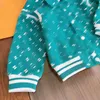 Projektant Baby Tracksuits Dzieciowe garnitury Rozmiar 110-160 cm 2pcs nici elastyczne mankiety kurtka klapowa i kwiatowe spodnie z nadrukiem 30 sierpnia