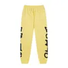 Żółte spodnie dresowe spodnie Mężczyźni bawełniane nadrukowane brązowe joggery sznurka street noszenie spodni hip hop