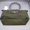 Borse firmate da donna Saldi Manico piccolo Fionda a mano Ricamo Capacità di gnocchi Borsa da donna Sac Femme Spalla portatile Tasche Borsa da spiaggia corta Tote Grande