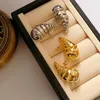 Brincos de garanhão cor de ouro clássico de água oca de água para mulheres Twist Spiral Metal Ins Creative Design Jewelry Gift 2023