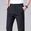 Męskie spodnie Summer Casual Men Thin Business Stretch Slim Elastyczna Talia Jogger Koreański klasyczny czarny szary niebieskie spodnie Mężczyzna 230904