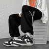 Pantaloni da uomo Bianco Uomo Hip Hop Cargo Moda Jogging Casual Streetwear Nastri multi-tasca Harem Pantaloni sportivi187E
