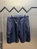 Pantaloncini da uomo firmati Alta edizione Moda di lusso Estate Triangolo sottile Etichetta in ferro Bermuda in nylon rigenerato Casual 7GQM