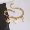 Collier tiff de créateur de mode haut en acier titane version coréenne en or 18 carats t famille lettrage amour petite clé de verrouillage bracelet double couche pour femmes douces réduisant l'âge