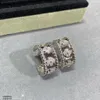 Pendientes con dijes vintage Diseñador de la marca Perle Cobre Cristal completo Trébol de cuatro hojas Pendientes redondos con clip de bucle pequeño con caja Regalo de fiesta Joyería para mujer