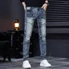 Męskie dżinsy 2023 Stylowe rozryte spodnie Sym Szczupły strzępione dżinsowe ubrania mody spodnie pantelones
