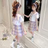 Ensembles de vêtements 2023 Adolescents Mode d'été Enfant École primaire Fille JK Uniforme Bow Sailor Collier Blouse Chemise Plaid Jupe Plissée 2pc / Set