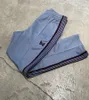 Pantaloni da uomo Uomo Donna 1 Tessitura di qualità Ricamo a righe Farfalla Aghi Traccia Pantaloni AWGE ss 230906