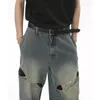 Jeans masculinos 2023 primavera e outono botão de metal emenda pesado design oco sentido de perna larga para homens mulheres