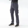 Мужские брюки, эластичные водонепроницаемые походные мужские брюки размера плюс 7XL, зимние теплые флисовые брюки с мягкой оболочкой, уличные ветрозащитные спортивные штаны-карго 230906