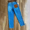 Jeans casual affusolati da donna con tasca in collage di pelle, jeans blu lavati a vita alta