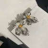 Vintage silver earrings, delicate fashion blooming flower shapes, simple atmospheric designer jewelry, weddings, banquets, Valentine's Day, Christmas, gifts