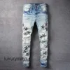 Jeans amirrs designer t shirts 2023 jean casual hip hop slitna ut och tvättade stänk bläck färg målning smal passform herr axcs