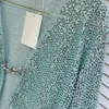 Kvinnors stickor 2023 Tidig höst Fashion Elegant Mint Green Beaded Magic Sequined Cardigans Women Runway Långärmad Deep V Neck -knapp