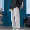 Pantaloni da uomo tendenza casual per la primavera e l'estate Leggings sportivi larghi drappeggiati neri