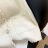 Chalecos informales de estilo retráctil con cuello en V, chaleco tejido de Seda brillante para mujer, Top de punto de un solo pecho para primavera y otoño