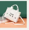 2023 Summer Crossbody Carrying Sail and Korean One Shoulder Letter Small Square Women's Bag in 60% Off Outlet Online