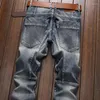 Mäns jeans vårens hösttvätt denim koreansk stil blå designer cowboy cykling motorcykel skarv vintage last strech pant je231j