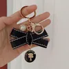 Designers Fashion Keyring Keychains Luxury Brands Pearl Handmade Keyrings Women Lovers Par Bags Cars Key Chains Lanyards233B