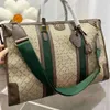 High-End Men's Travel Bag design axel handväska topp märke läder tryck spel tote bagage kvinnor mode utomhus affärs bred axel rem crossbody väska